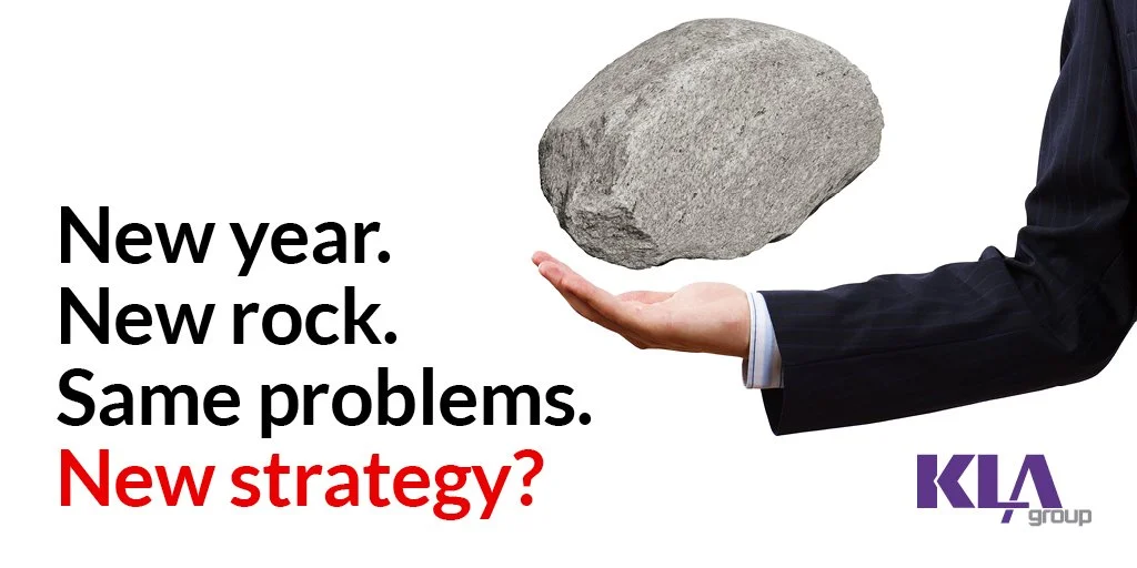 businessperson juggling boulder